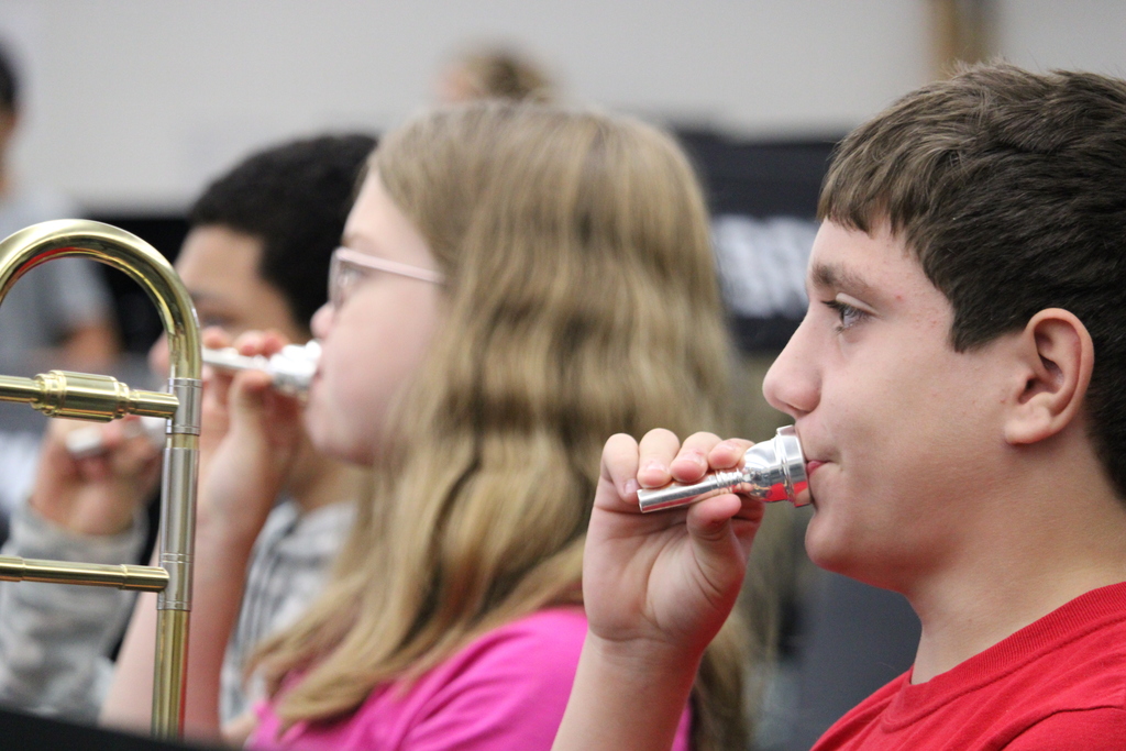 Student blowing into mouthpiece
